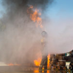 Firemen are using water to extinguish the fire. Firefighter training Firemen are using water to extinguish the fire. Firefighter training