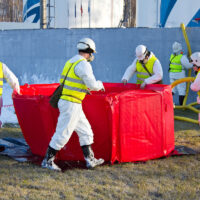 Group of rescuers eliminates consequences of accident, leak of chemical product elimination Group of rescuers eliminates consequences of accident, leak of chemical product elimination