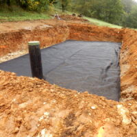 Membrane laid to separate the sand from the gravel in the construction of a sand and gravel filter bed Membrane laid to separate the sand from the gravel in the construction of a sand and gravel filter bed