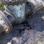 Effects nature from soil contaminated with chemicals and oil. Environmental disaster, contamination of the environment, toxic, pollution, detail. Wreck of oil tanks.oil pollution on soil Effects nature from soil contaminated with chemicals and oil. Environmental disaster, contamination of the environment, toxic, pollution, detail. Wreck of oil tanks.oil pollution on soil