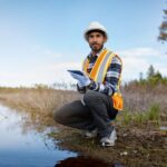 Marine biologist analysing water test results on a tablet in Canada Marine biologist analysing water test results on a tablet in Canada