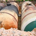 Large tank for gasoline in the excavated quarry for storage of petroleum products. Large tank for gasoline in the excavated quarry for storage of petroleum products.