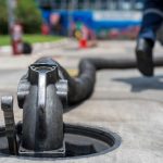 A tanker truck driver delivers gasoline A tanker truck driver delivers gasoline