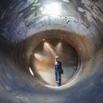 Working male inspection weld underground of tank equipment tunnel By using the flashlight in side confined. Working male inspection weld underground of tank equipment tunnel By using the flashlight in side confined.