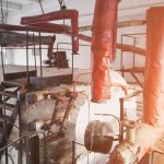 interior of the production room of the boiler station for residential heating, old and abondoned station