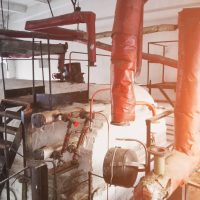 interior of the production room of the boiler station for residential heating, old and abondoned station